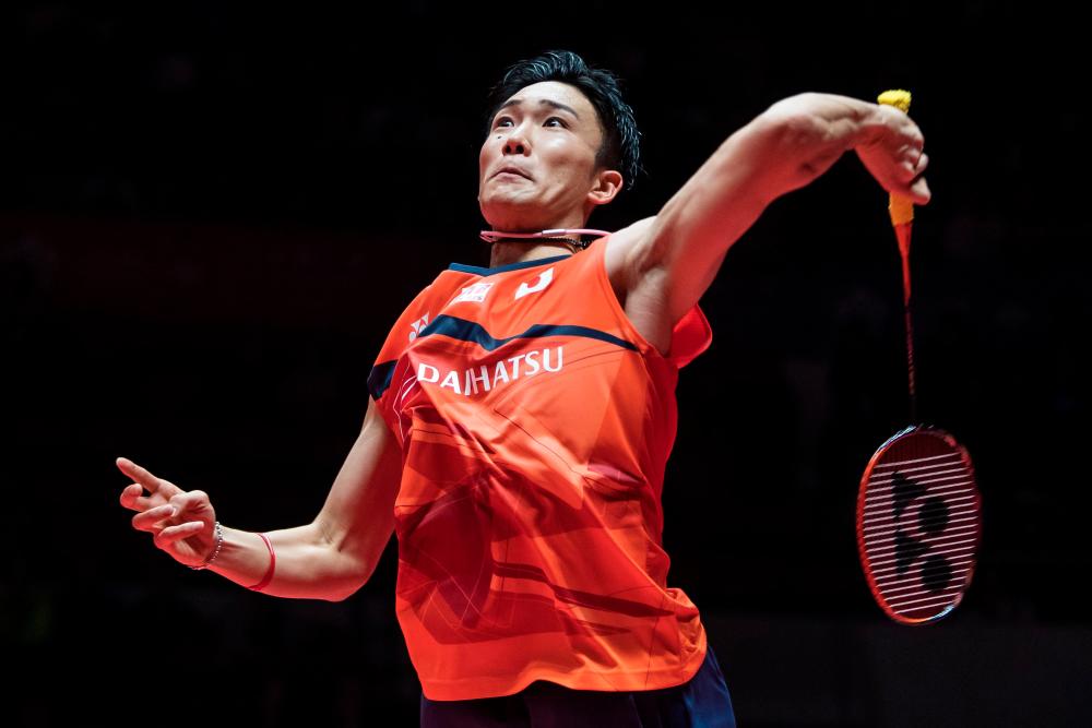Kento Momota of Japan hits a return against Wang Tzu Wei of Taiwan during their men's singles semi-final match at the BWF World Tour Finals badminton tournament in Guangzhou in China's southern Guangdong province on December 14, 2019. - AFP