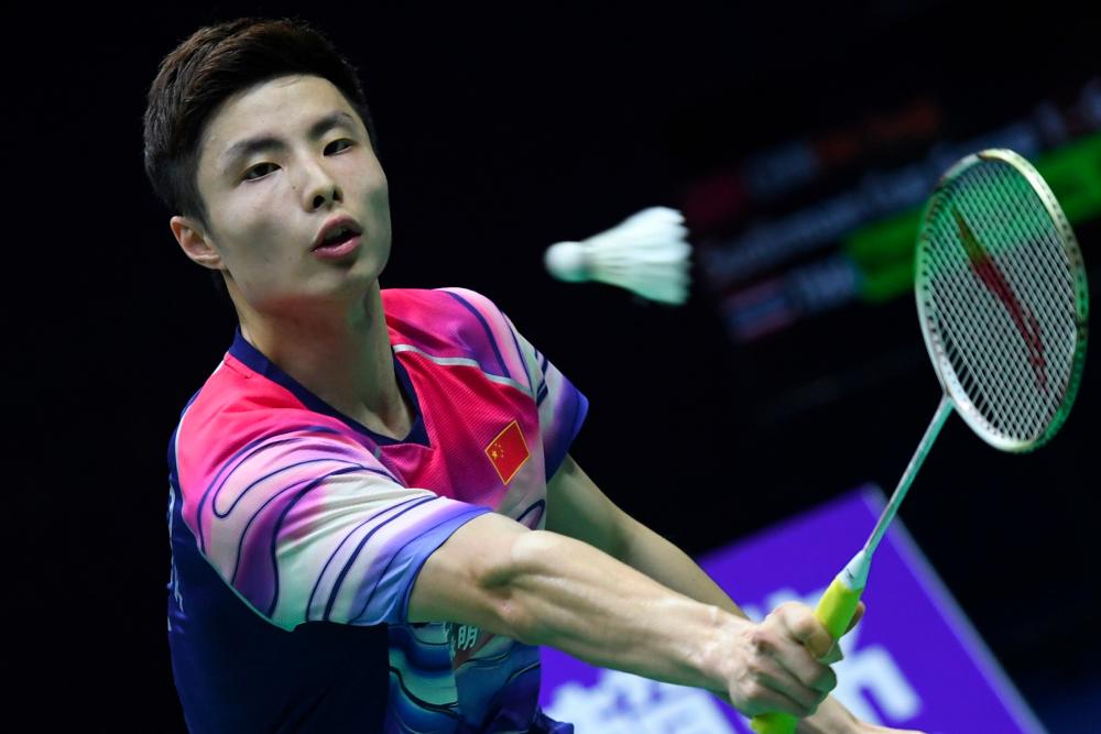 China's Shi Yuqi hits a return against Thailand's Kantaphon Wangcharoen during their men's singles semi-final match at the 2019 Sudirman Cup world badminton championships in Nanning in China's southern Guangxi region on May 25, 2019. — AFP