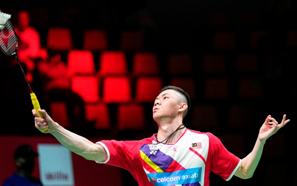 Malaysia’s Jia Lee Zii competes with Japan’s Kento Momota (unseen) during a men’s single match in the Thomas Cup men’s team Badminton match between Japan and Malaysia in in Aarhus, Denmark, on October 14, 2021. AFPpix