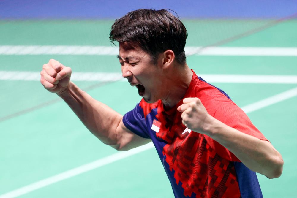 Singapore's Loh Kean Yew celebrates beating India's Srikanth Kidambi during the men's singles final badminton match of the BWF World Championships in Huelva, on December 19, 2021. AFPPIX