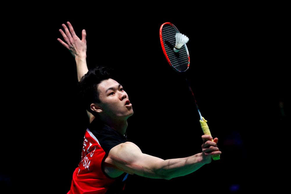 Malaysia’s Lee Zii Jia returns against Denmark’s Viktor Axelsen during the men’s singles final on the last day of the All England Open Badminton Championship at the Utilita Arena in Birmingham, central England, on March 21, 2021. AFPpix