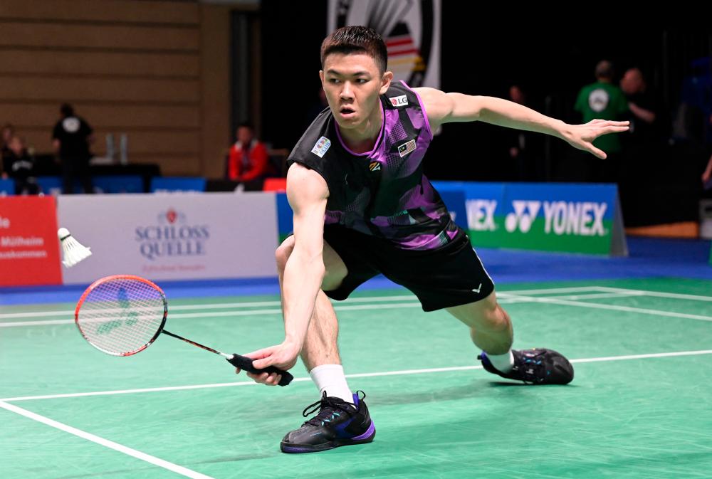 Lee Zii Jia of Malaysia plays against Magnus Johannesen of Denmark during the men’s singles first round match of the Badminton German Open in Muelheim, western Germany on March 8, 2023/AFPPix