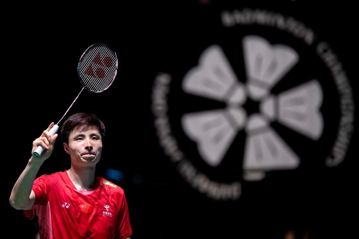 China’s Shi Yuqi celebrates his victory against France’s Alex Lanier during their men’s singles final match on the final day of the Japan Open badminton tournament at Tokyo Gymnasium in Tokyo on July 20, 2025. - Yuichi YAMAZAKI / AFP