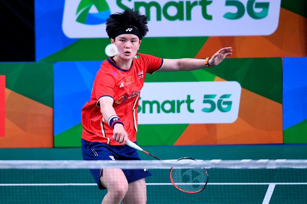 China's Wang Zhiyi hits a return against Taiwan's Wen Chi Shu during their women's singles quarter final match at the Badminton Asia Championships in Muntinlupa, suburban Manila on April 29, 2022. AFPPIX