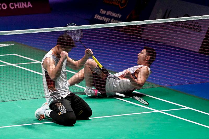 Nur Izzuddin (left) and Goh Sze Fei of Malaysia celebrate after winning against Kim Astrup and Anders Rasmussen of Denmark (not in pic) at the men’s doubles final match of the Clash Royale Arctic Open badminton event in Vantaa, Finland, on October 13, 2024. - Finland OUT