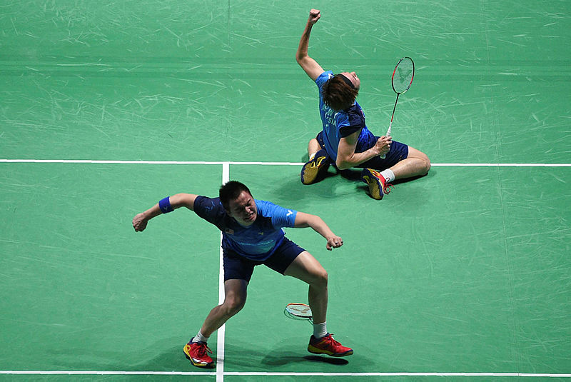 Aaron Chia Soh (L) Wooi Yik (R) celebrate after beating Indonesia’s Fajar Alfian-Muhammad Rian Ardianto in the semi-finals of the All England Badminton Championships, on March 9, 2019. — AFP