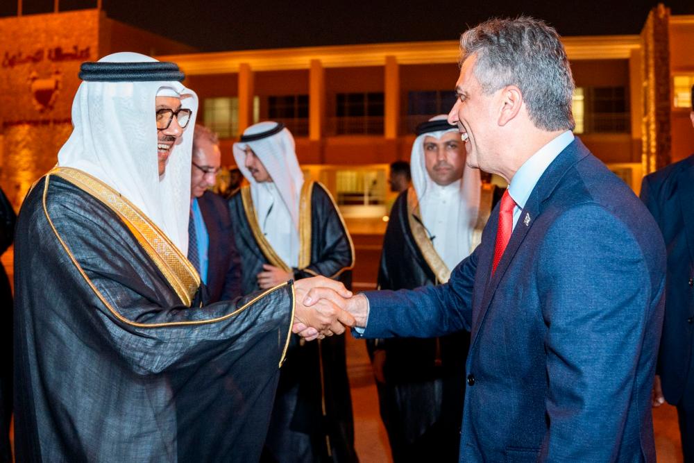 A handout picture released by Bahrain's official news agency (BNA) on September 3, 2023 shows Bahrain's Foreign Minister Abdullatif bin Rashid al-Zayani receiving his Israeli counterpart Eli Cohen upon his arrival in Manama. AFPPIX