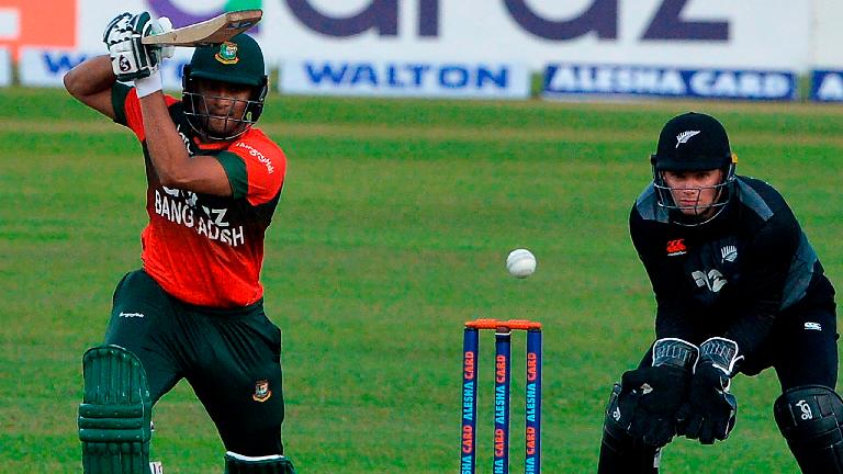 Bangladesh’s Shakib Al Hasan (left) plays a shot during the first Twenty20 international cricket match against New Zealand at the Sher-e-Bangla National Cricket Stadium in Dhaka. – AFPPIX