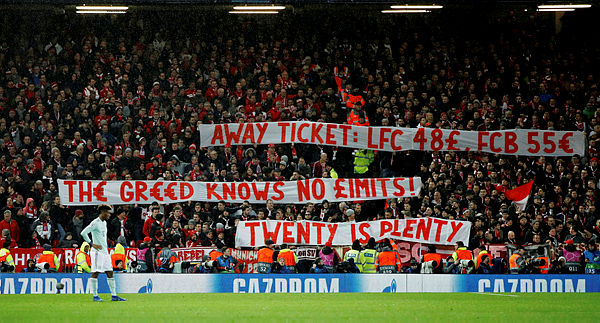 Bayern Munich fans display a banner in reference to ticket prices — Reuters
