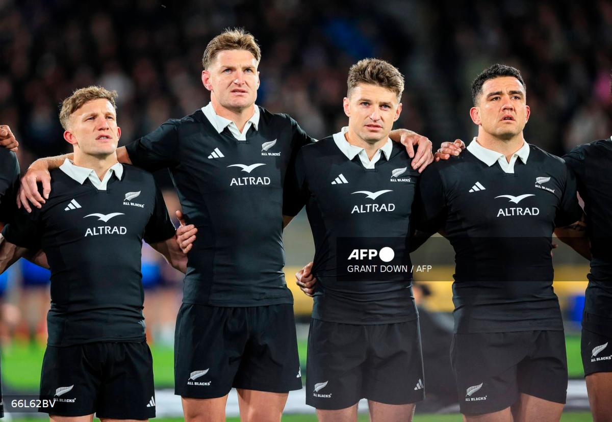 (L to R) New Zealand's Damian McKenzie, Jordie Barrett, Beauden Barrett and Codie Taylor sing the national anthems prior to their second international rugby test match between New Zealand and France at Sky Stadium in Wellington on July 12, 2025. - Grant Down / AFP