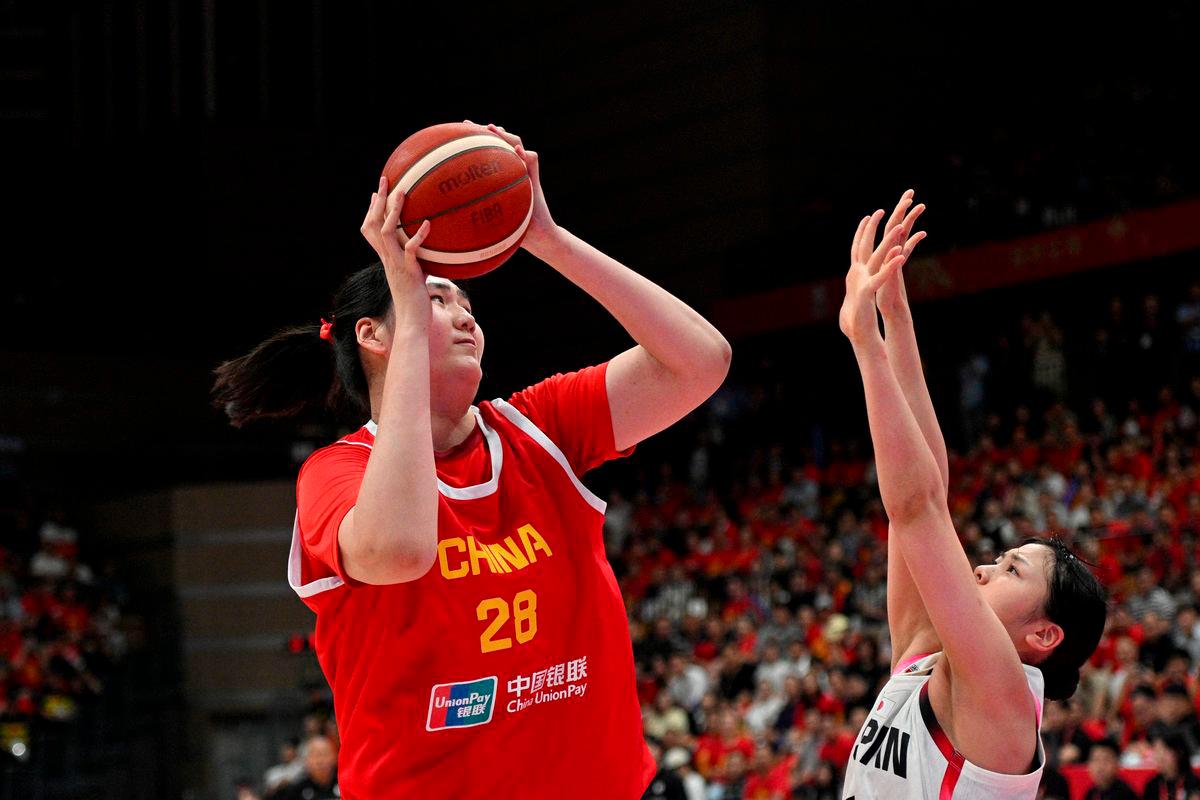 China’s Zhang Ziyu (#28) shoots as Japan’s Azusa Asahina (#14/R) tries to block during a warm-up game ahead of the FIBA Women’s Asia Cup in Xian, China’s central Shaanxi province on June 18, 2025. (Photo by AFP)