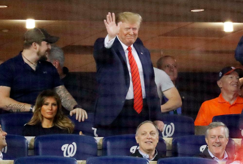 President Donald Trump attends Game Five of the 2019 World Series between the Houston Astros and the Washington Nationals at Nationals Park on Oct 27, 2019 in Washington, DC. — AFP