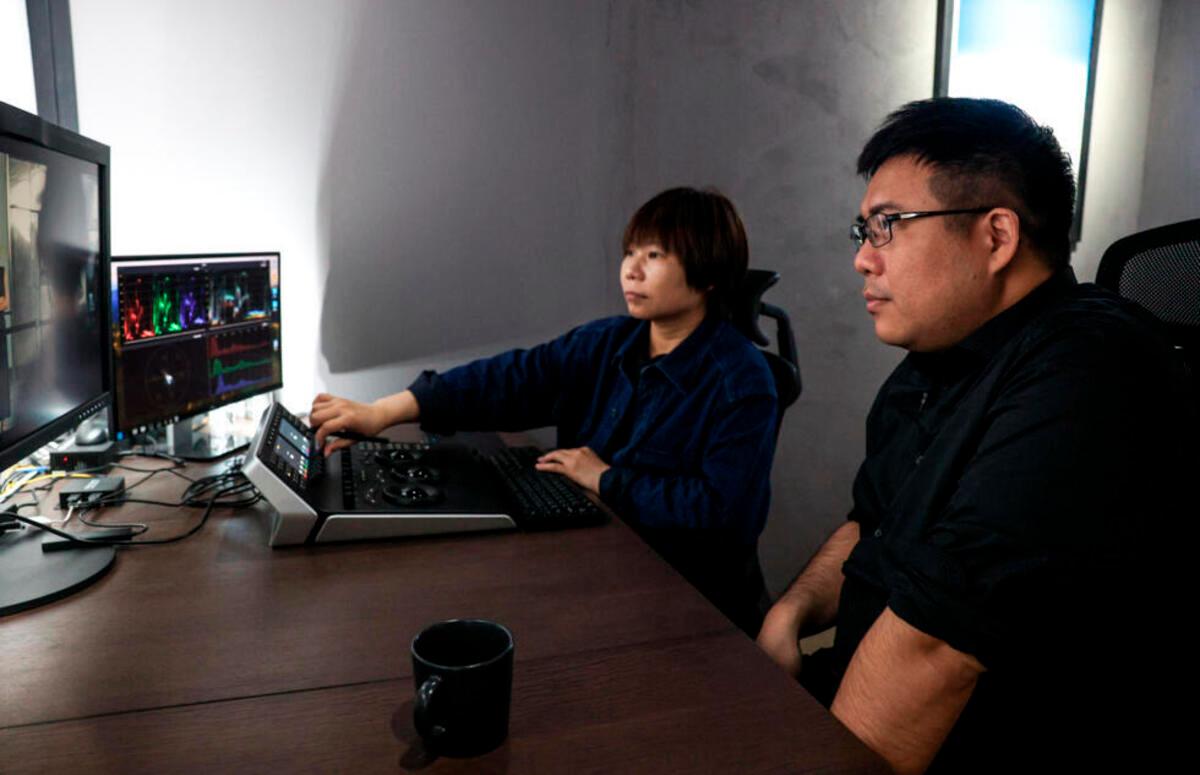 Colorist Liang Yu Fang works on post-production of the Taiwanese television series “Zero Day”. - AFP