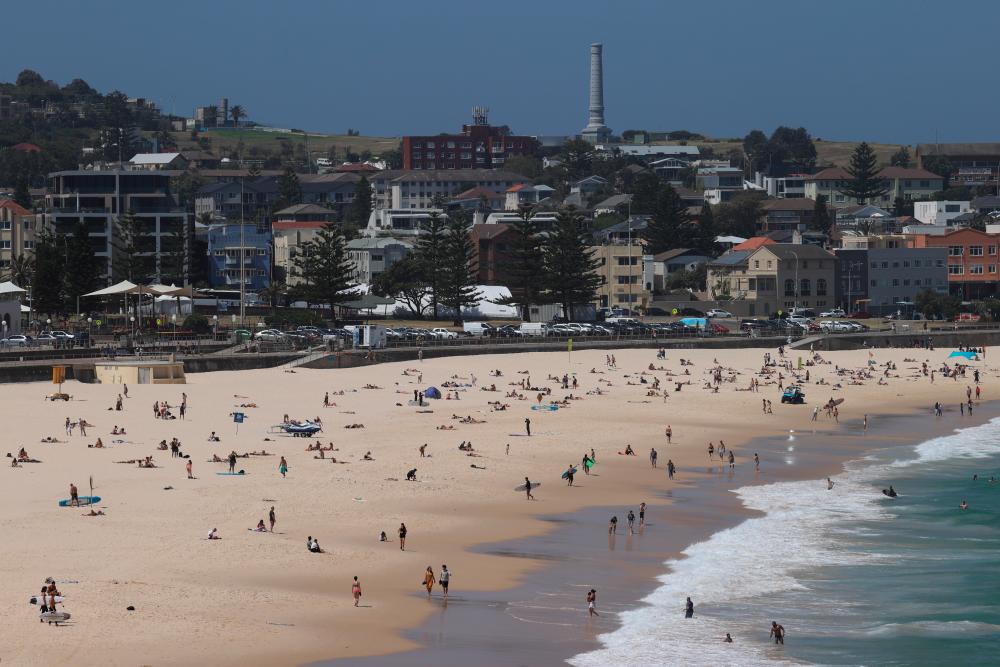 Beachgoers soak up the sun on the first day of summer at Bondi Beach in Sydney, Australia, December 1, 2020. — Reuters