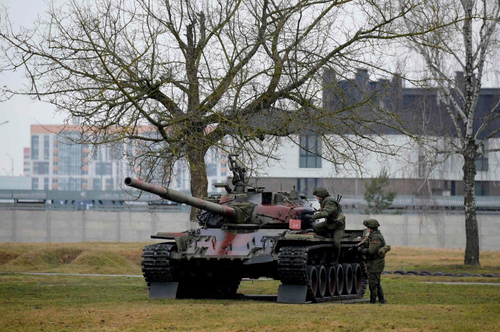 Paratroopers of the 38th Separate Guards Air Assault Brigade - a special forces brigade of the Armed Forces of Belarus - mount a tank during training exercises at the brigade’s grounds in Brest on February 13, 2023. AFPPIX