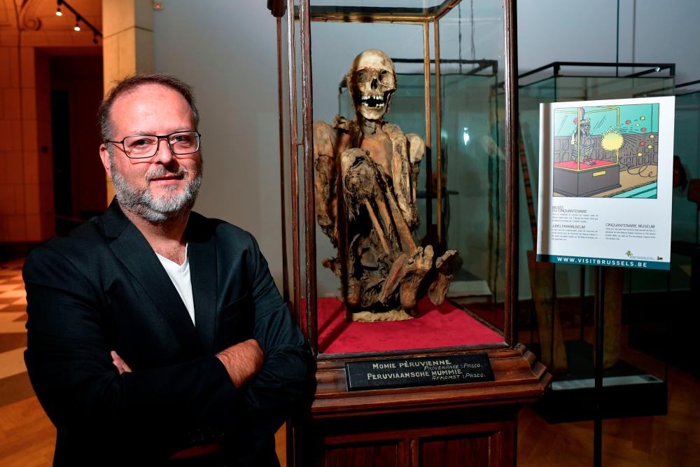 Serge Lemaitre, archaeologist and curator of the Americas collections at the Royal Museums of Art and History in Brussels poses on July 13, 2020 during a interview about the Inca mummy that allegedly inspired Herge for his character Rascar Capac, hero of the Tintin album “The Seven Crystal Balls”. / AFP / JOHN THYS / RESTRICTED TO EDITORIAL USE
