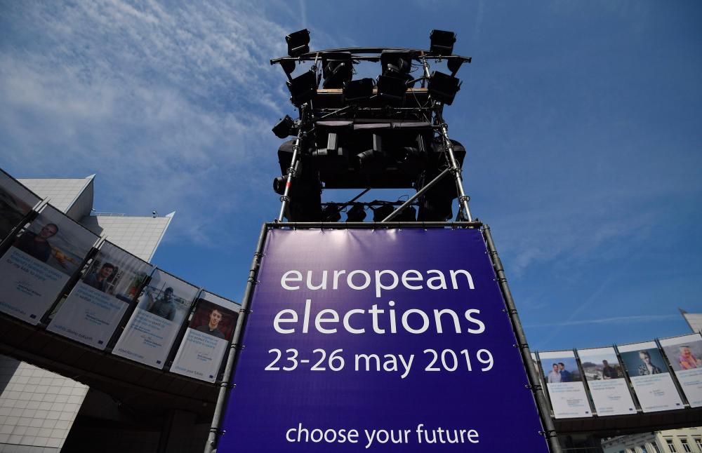 A picture taken in Brussels on May 24, 2019 shows a poster announcing the European elections set in front of the European Parliament. - AFP