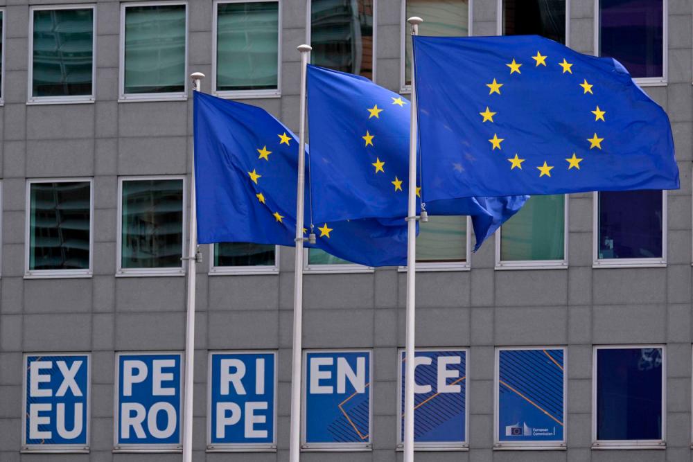 This photograph shows European flags outside the EU headquarters in Brussels on May 6, 2025.AFPpix