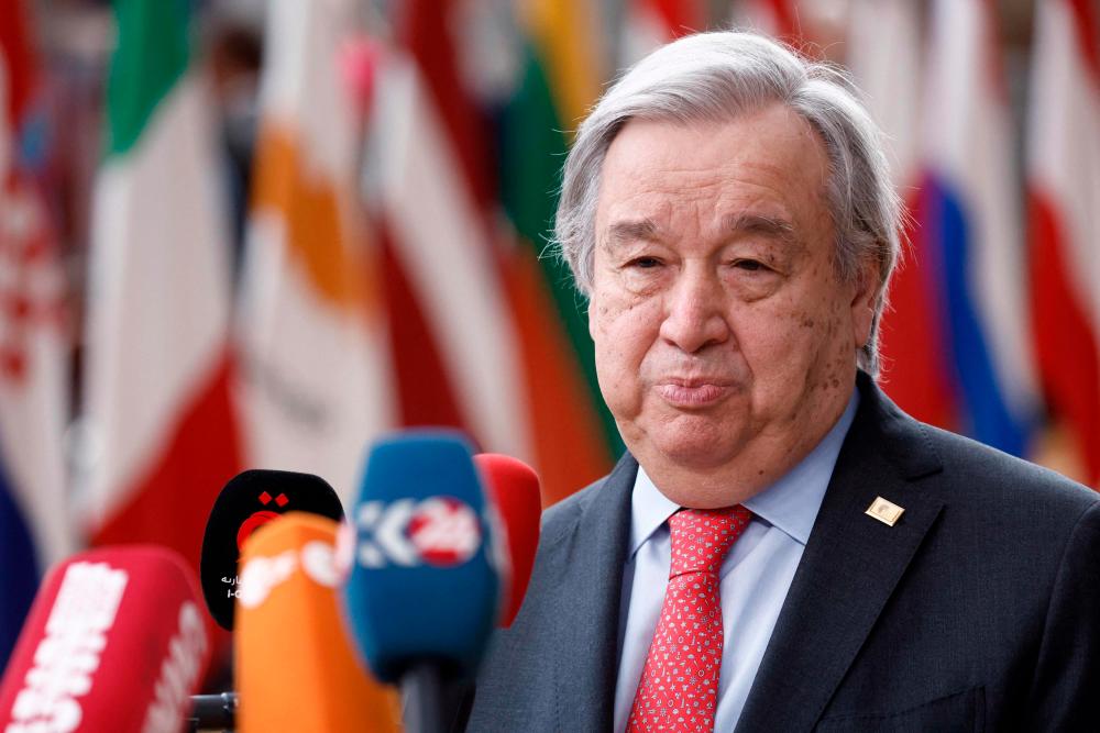 U.N. Secretary-General António Guterres (L) speaks on arrival for a EU Summit, at the EU headquarters in Brussels, on March 23, 2023. AFPPIX