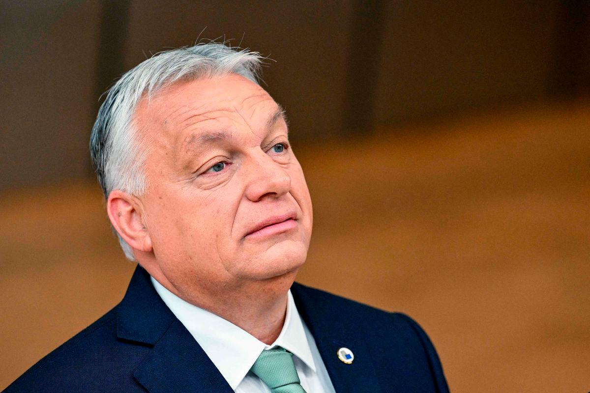 Hungary’s Prime Minister Viktor Orban speaks to the press as he arrives to attend the European Council in Brussels on June 26, 2025. (Photo by NICOLAS TUCAT / AFP)