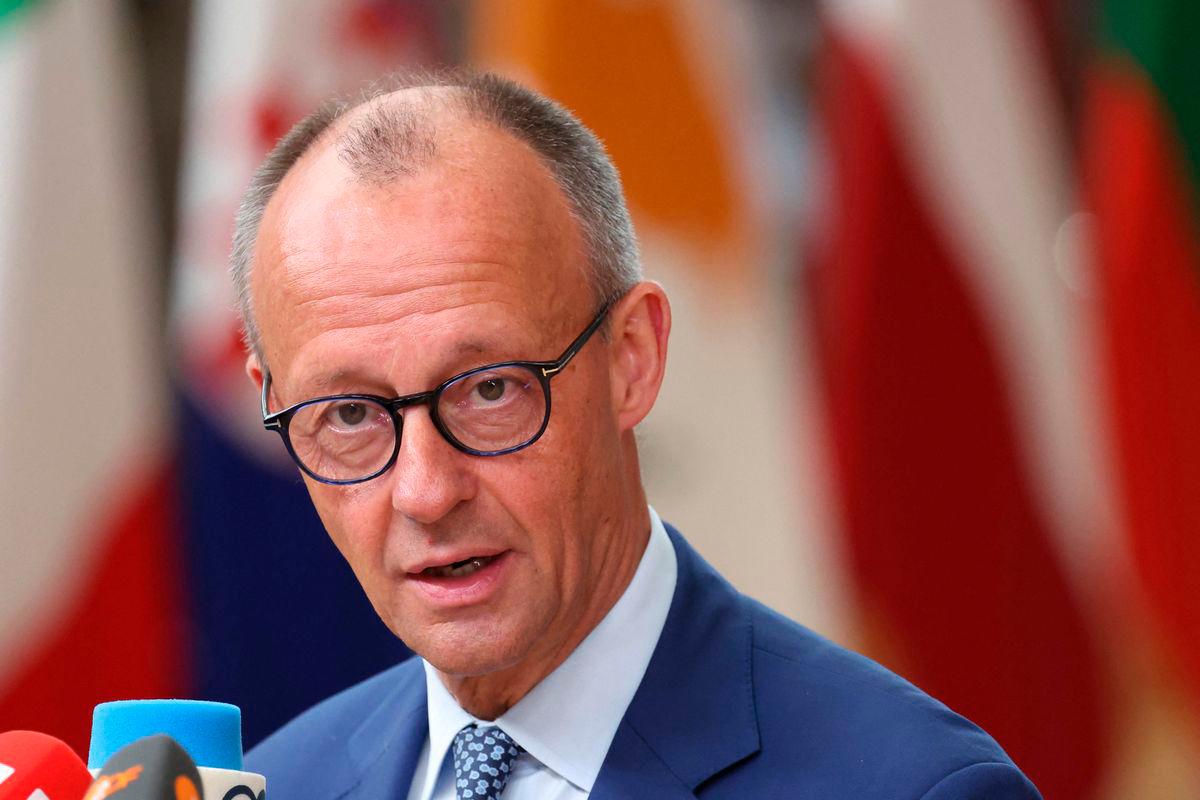Germany’s Chancellor Friedrich Merz speaks to the press as he arrives to attend the European Council in Brussels on June 26, 2025. (Photo by ALAIN JOCARD / AFP)