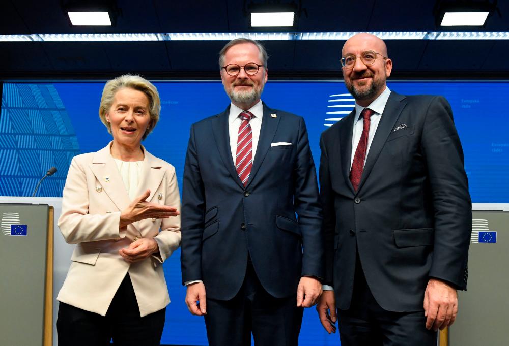 From left: Von der Leyen, Czech Republic Prime Minister Petr Fiala and European Council President Charles Michel at the end of a press conference after the European Council Summit in Brussels on Thursday. – AFPpic