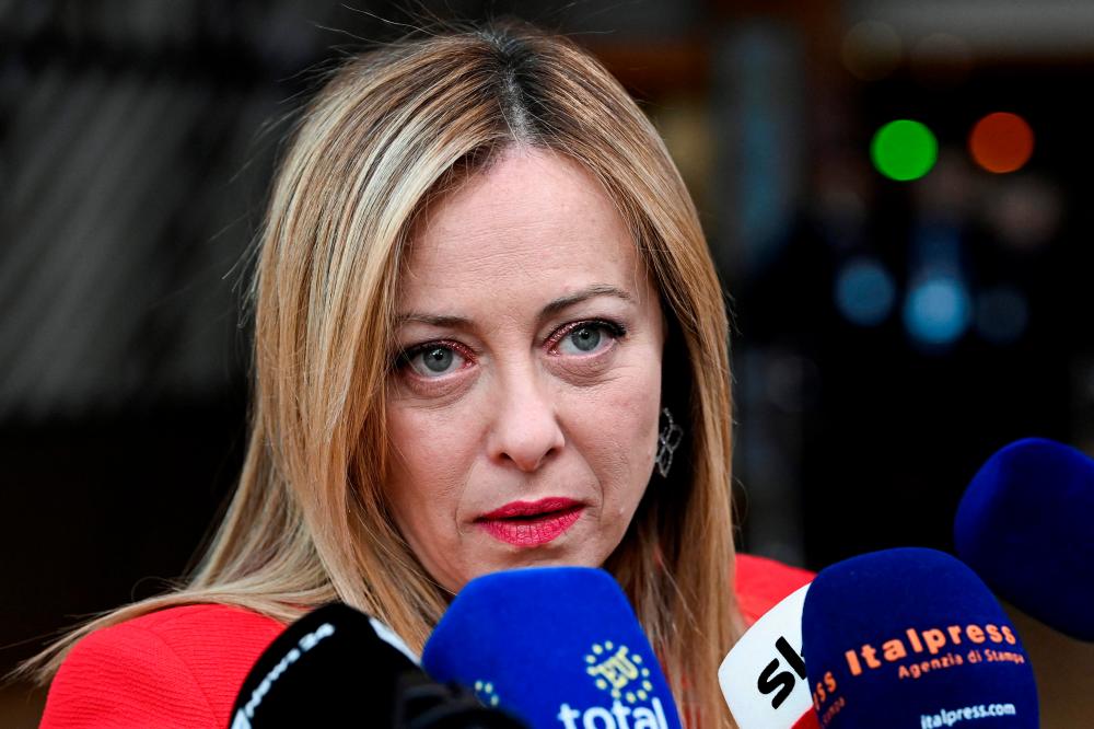 Meloni answers journalists’ questions as she arrives for a summit at EU parliament in Brussels, on February 9, 2023. AFPPIX