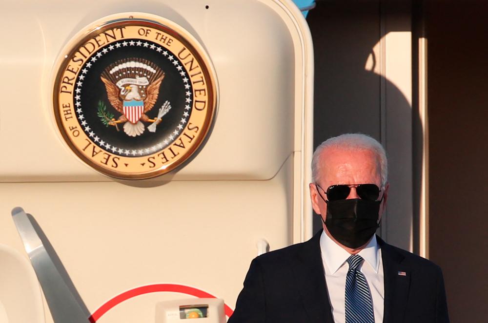 US President Joe Biden gets off the Air Force One after arriving at Melsbroek Military Airport in Brussels, on June 13, 2021, ahead of the NATO Summit and EU-US summit. – AFP