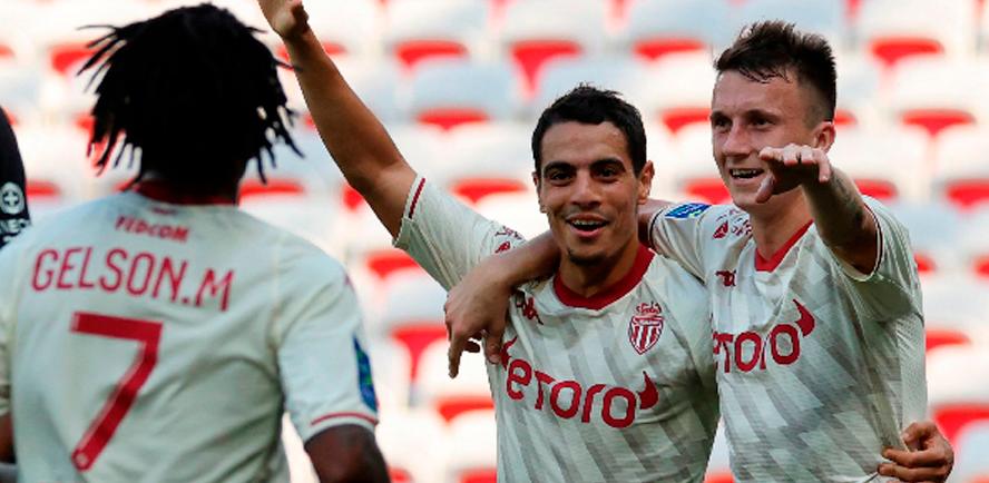 Monaco’s Aleksandr Golovin (right) celebrates with teammate Wissam Ben Yedder (centre) after scoring a goal during their French L1 match. – AFPPIX