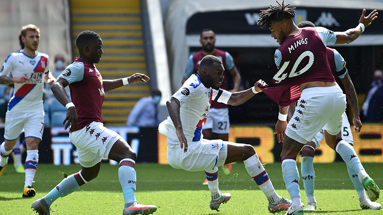 Crystal Palace’s Christian Benteke (centre) fights for the ball with Aston Villa’s Tyrone Mings (right) during the Premier League match at Villa Park. – AFPPIX