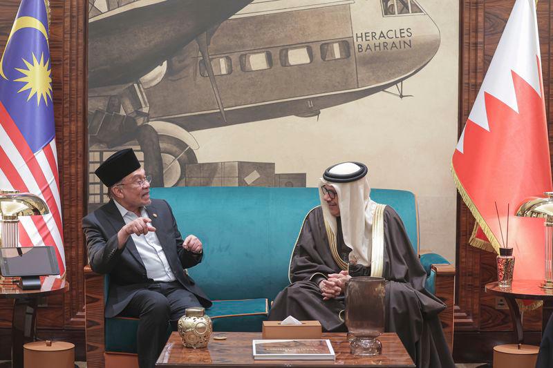 Prime Minister Datuk Seri Anwar Ibrahim (left) speaks with Bahraini Foreign Affairs Minister Dr Abdullatif Rashid Al Zayani upon arriving at the Bahrain International Airport for a three-day official visit to Bahrain under the invitation of Bahrain’s Crown Prince and Prime Minister Salman Hamad Al Khalifa. - BERNAMAPIX