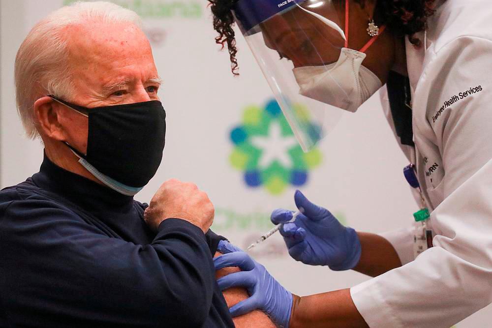 Nurse practitioner Tabe Mase gives US President-elect Joe Biden a dose of a vaccine against Covid-19 at ChristianaCare Christiana Hospital, in Newark, Delaware December 21, 2020. — Reuters