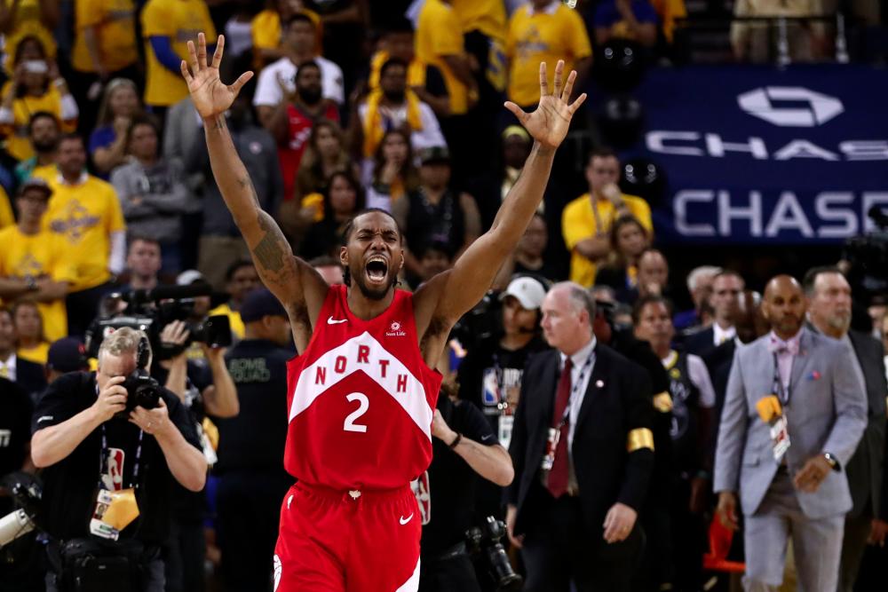 Kawhi Leonard #2 of the Toronto Raptors celebrates his teams win over the Golden State Warriors in Game Six to win the 2019 NBA Finals at ORACLE Arena on June 13, 2019 in Oakland, California. — AFP