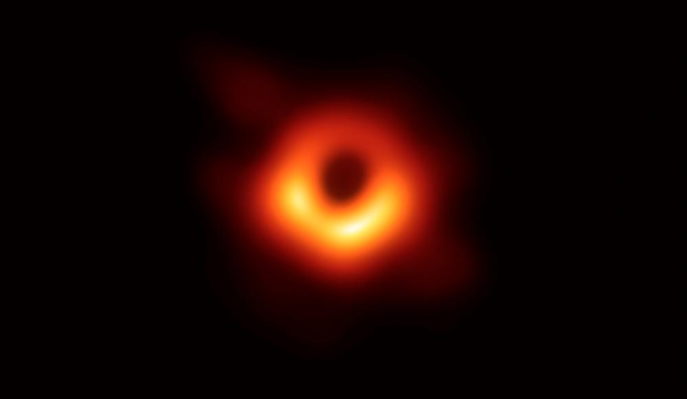 The Event Horizon Telescope Collaboration grabbed global headlines on April 10 when they published the first image of a supermassive black hole circled by a flame-orange halo of white hot plasma. © The EHT collaboration