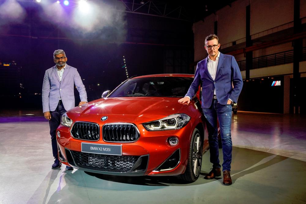 $!Hoelzl (right) and BMW Group Malaysia head of corporate communications Sashi Ambi with the BMW X2 M35i.