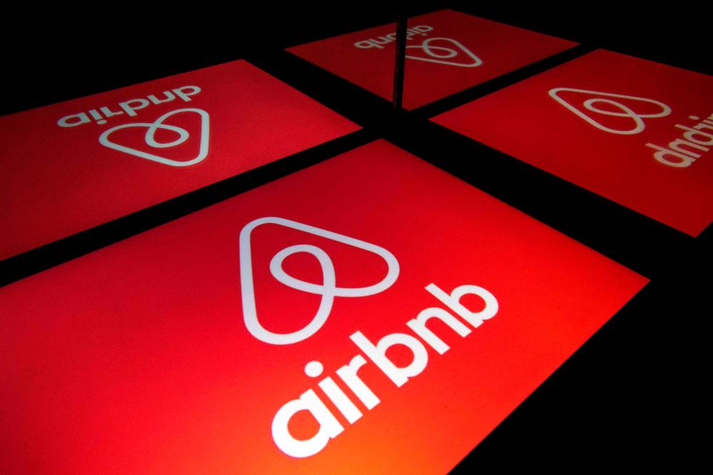 Illustration photo shows the logo of Airbnb displayed on a tablet in Paris. Airbnb is seeking to raise some US$2.6 billion in its upcoming share offering. – AFPPIX