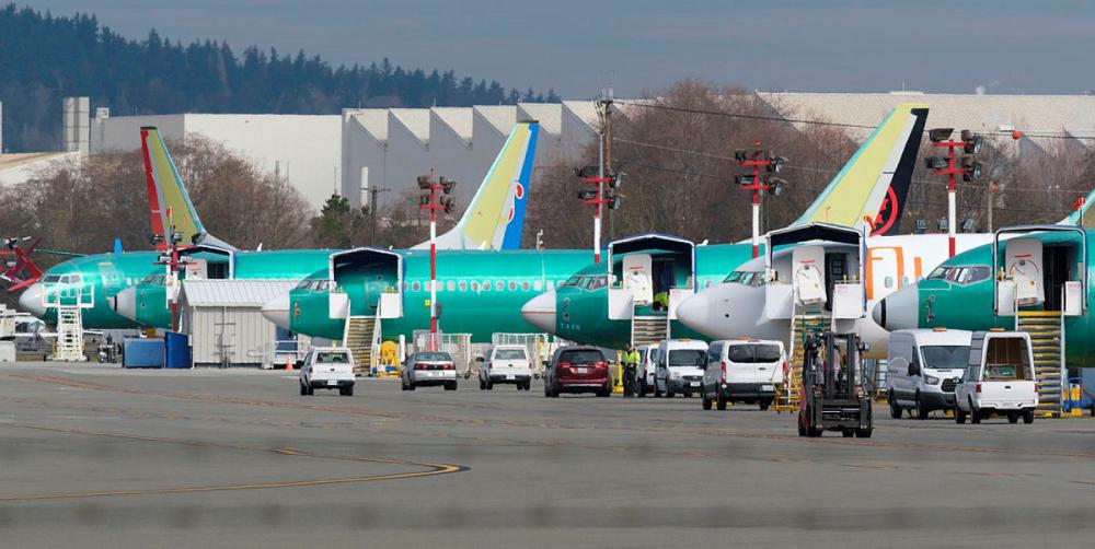 Boeing 737 airplanes, most of which are the MAX model, sit on the tarmac outside the on March 11, 2019 in Renton, Washington. — AFP