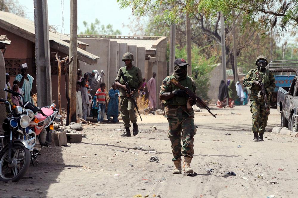 Nigerian troops seen patrolling the streets in Borno state in 2013. AFPPIX