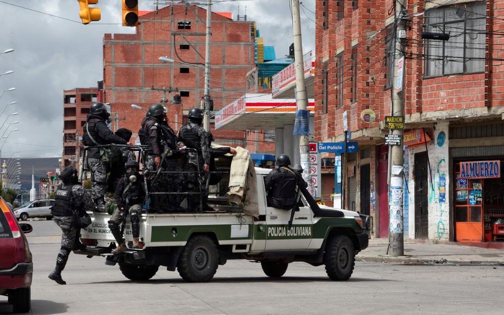 Police forces patrol the streets of El Alto on Nov 11, a day after the resignation of Bolivia's President Evo Morales. — AFP