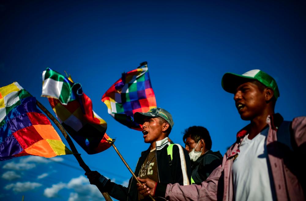 Supporters of Bolivian ex-President Evo Morales shout slogans during a demonstration in Cochabamba, on Nov 18. — AFP