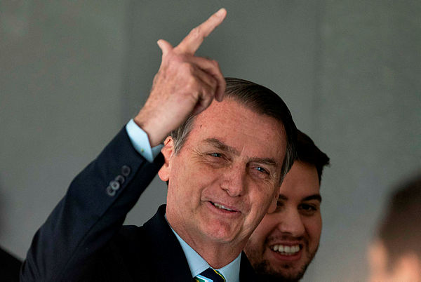 Brazil’s President Jair Bolsonaro gestures after receiving Paraguay’s President Mario Abdo Benitez (out of frame) at Planalto palace in Brasilia. Brazilian President Jair Bolsonaro arrived in Washington — AFP