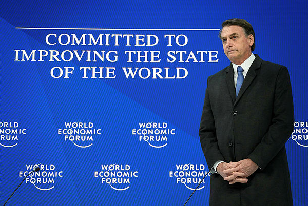 Brazilian President Jair Bolsonaro stands prior to delivering a speech during the World Economic Forum (WEF) annual meeting — AFP