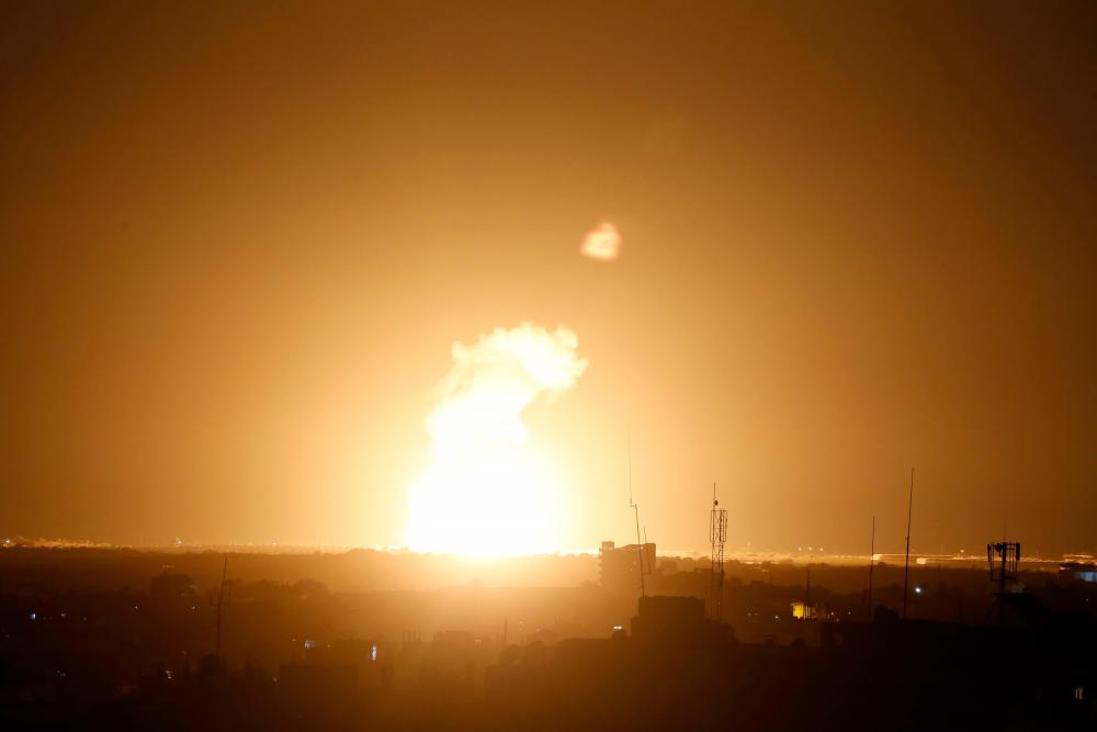 Flames are seen following an Israeli air strike in the town of Khan Yunis, in the southern Gaza Strip, early on November 22, 2020. — AFP