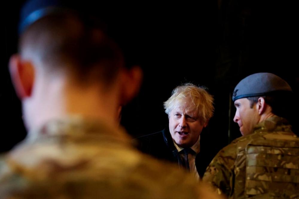 British Prime Minister Boris Johnson speaks with troops during a visit to the Royal Air Force Station in Waddington, Lincolnshire, on Feb 17. AFPpix