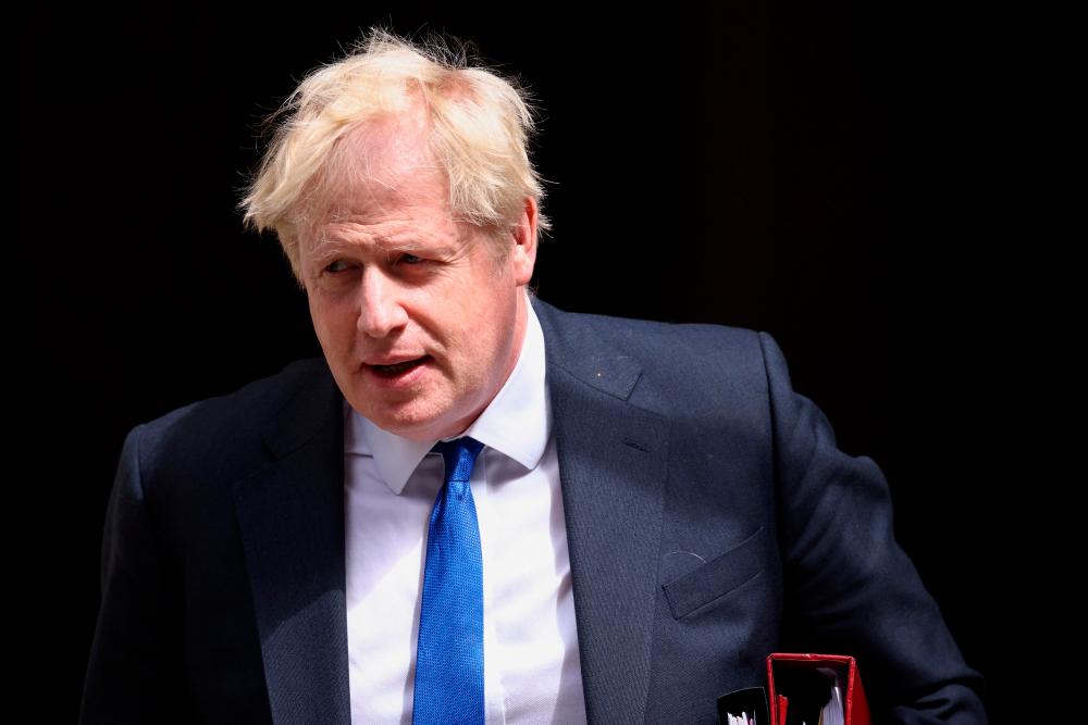 British Prime Minister Boris Johnson walks at Downing Street in London, Britain July 6, 2022. REUTERSpix
