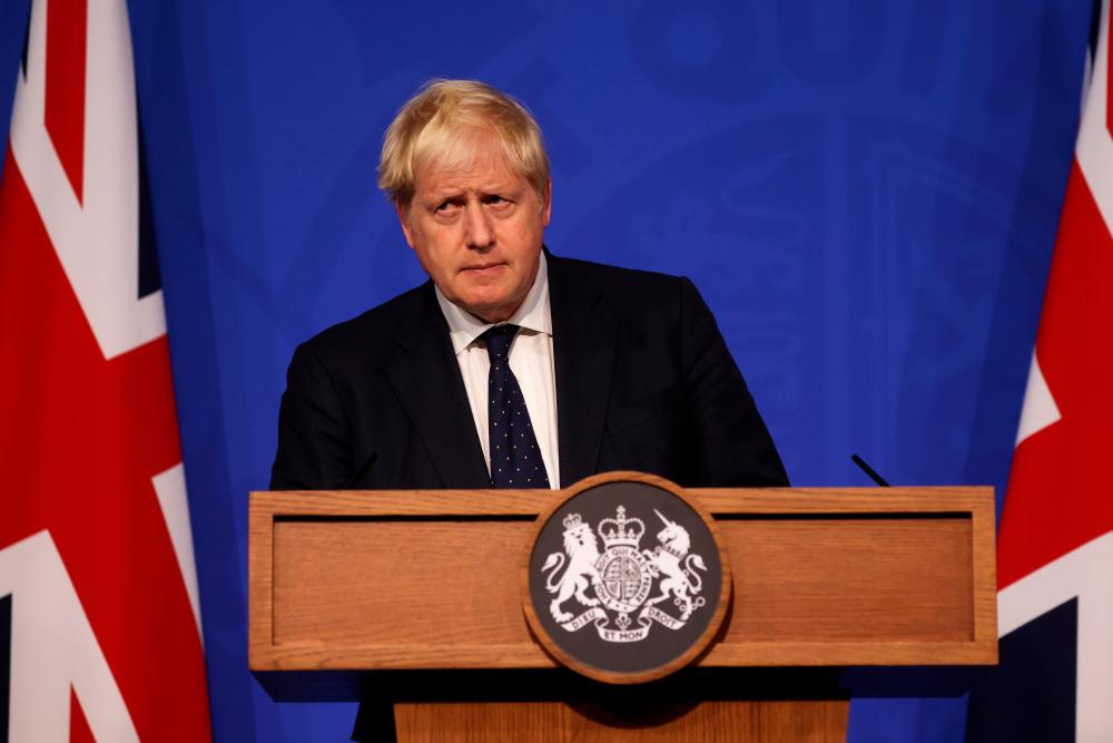 Britain's Prime Minister Boris Johnson looks on during a news conference on the coronavirus disease (Covid-19) in the Downing Street Briefing Room, London, Britain September 14, 2021. Dan Kitwood/Pool via REUTERSpix