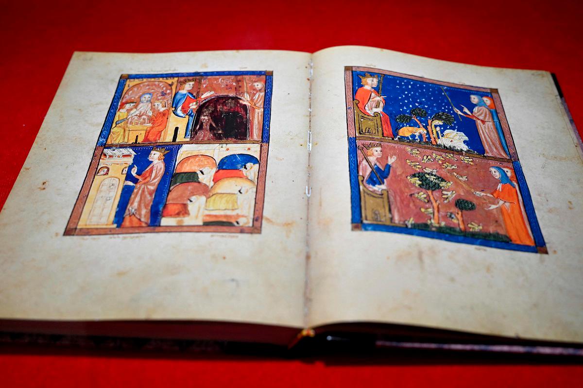 This photograph taken on August 19, 2025 shows the Sarajevo Haggadah manuscript preserved in a display case at Bosnia’s National Museum, in Sarajevo. - Elvis BARUKCIC / AFP