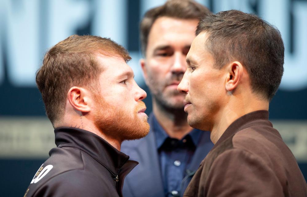 LAS VEGAS, NEVADA - SEPTEMBER 15: Undisputed super middleweight boxer Canelo Alvarez (L) faces off with Gennady Golovkin during a news conference at the KA Theatre at MGM Grand Hotel &amp; Casino on September 15, 2022 in Las Vegas, Nevada. AFPPIX
