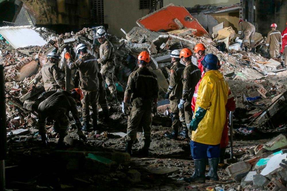 Rescue teams search for victims in the rubble of a collapsed building in the municipality of Paulista, on the outskirts of Recife, in Brazil’s northeastern state of Pernambuco, on July 7, 2023. AFPPIX