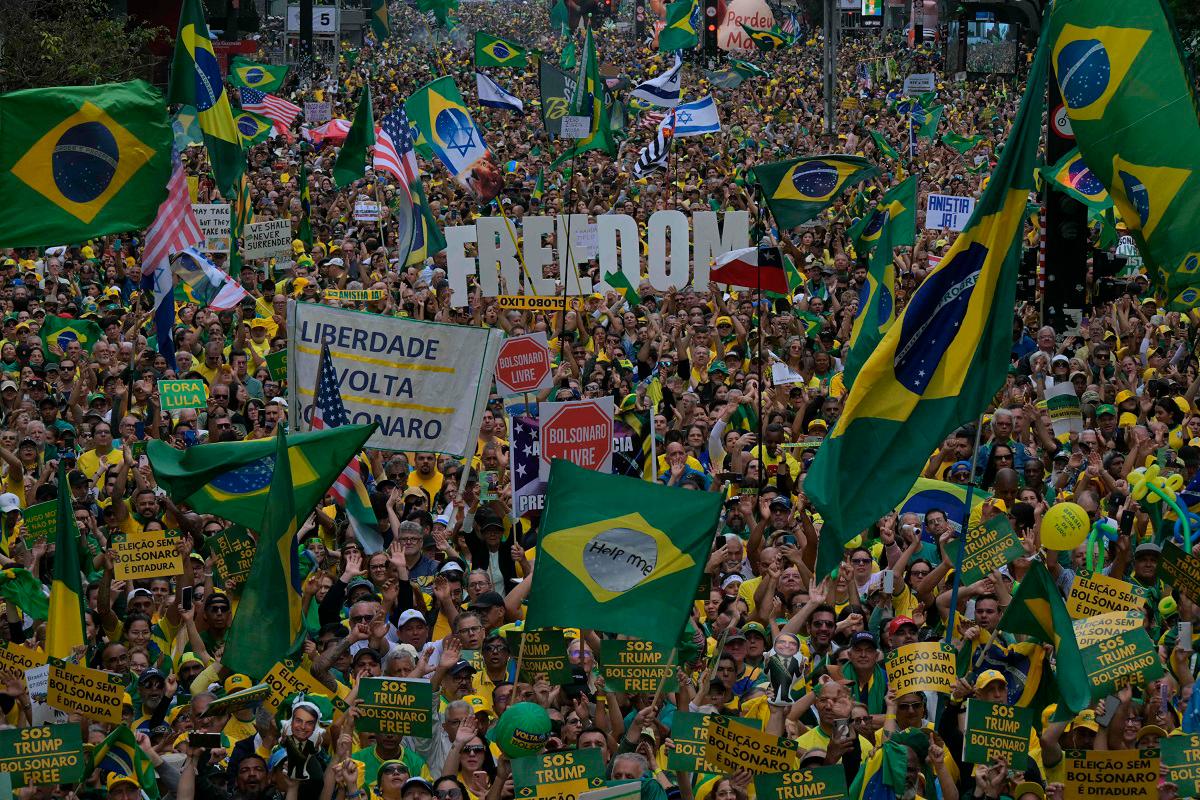 Supporters of Brazil’s former president (2019-2022) Jair Bolsonaro, on trial for his alleged role in an attempted coup, hold the word “Freedom” in a demonstration during Independence Day, in Sao Paulo, Brazil on September 7, 2025. - NELSON ALMEIDA / AFP